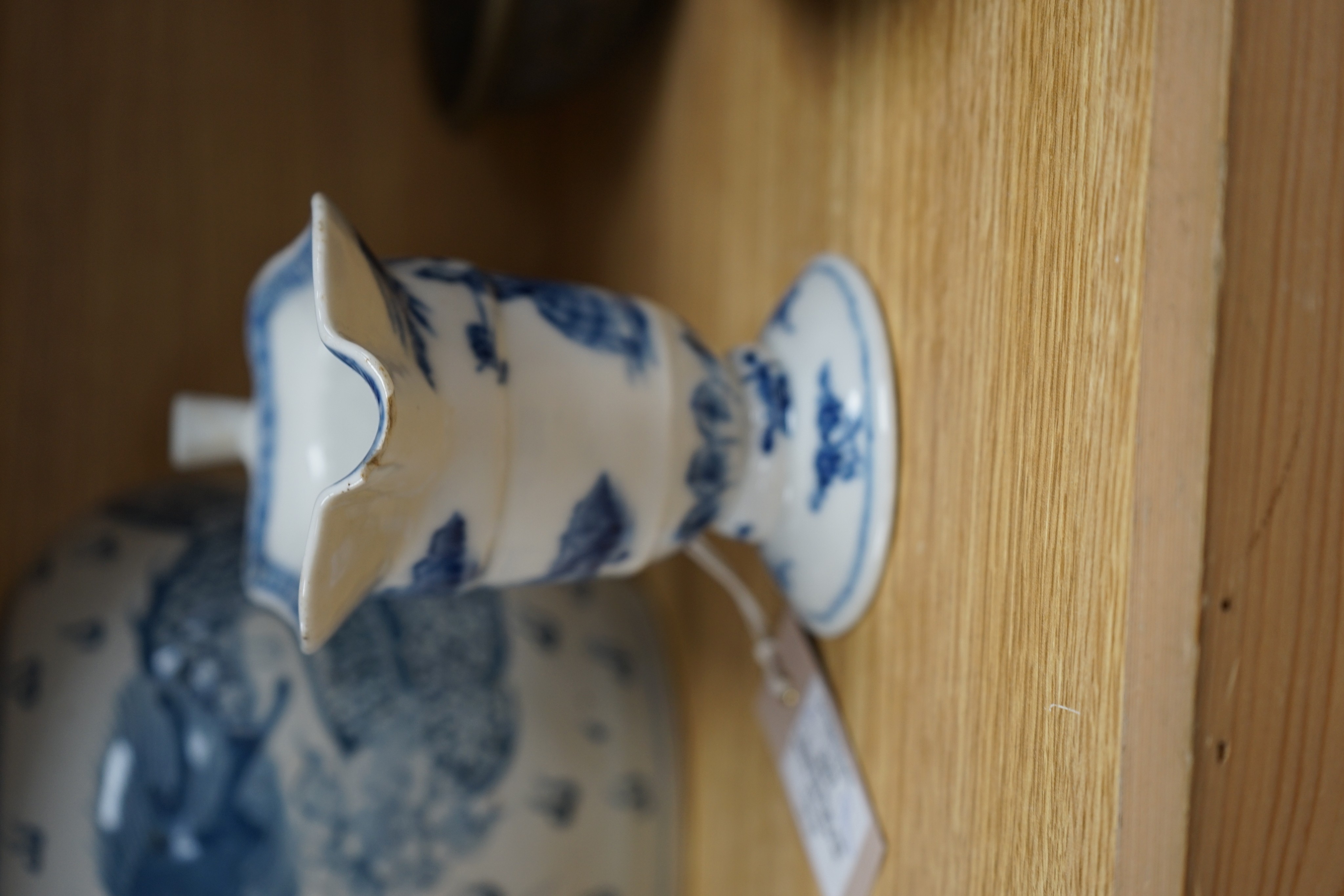 A Chinese blue and white jar, 20cm and a helmet shaped jug, 18th century and later